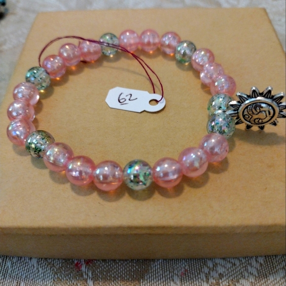 Artemis's Gems custom-made beaded bracelet with metal sun charm with face, pink - Picture 1 of 6